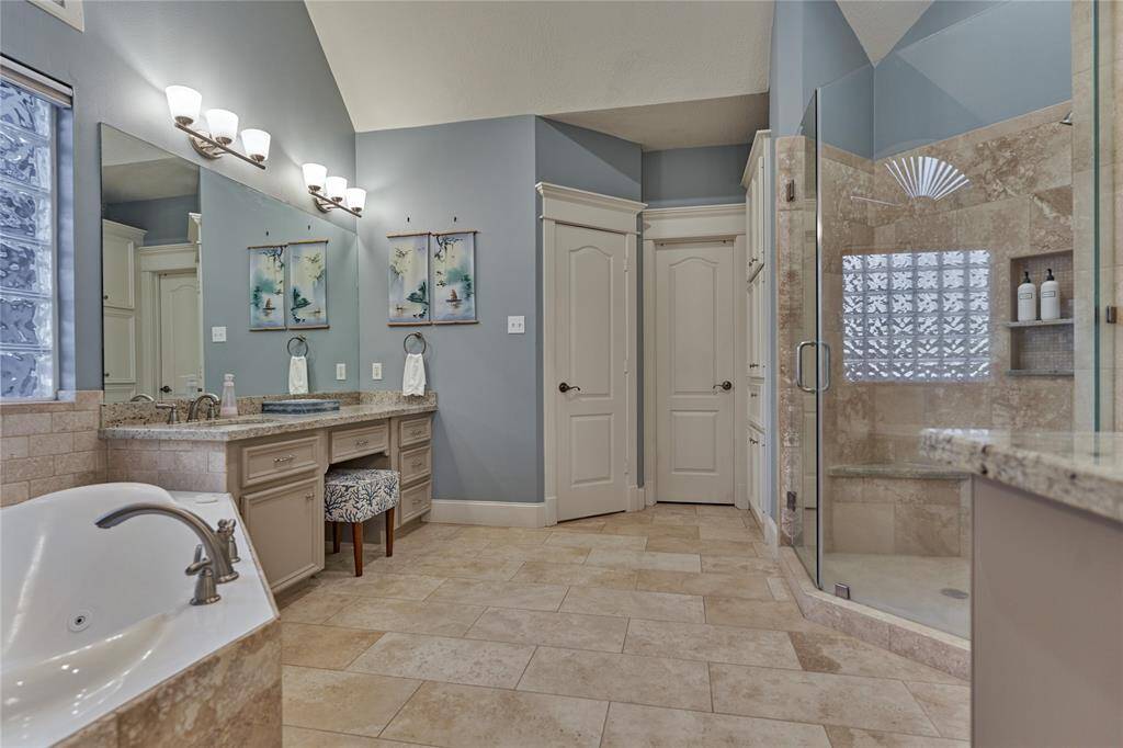 The ensuite is a place of relaxing and rejuvenating.  A vanity space and soaking tub for the lady of the house...