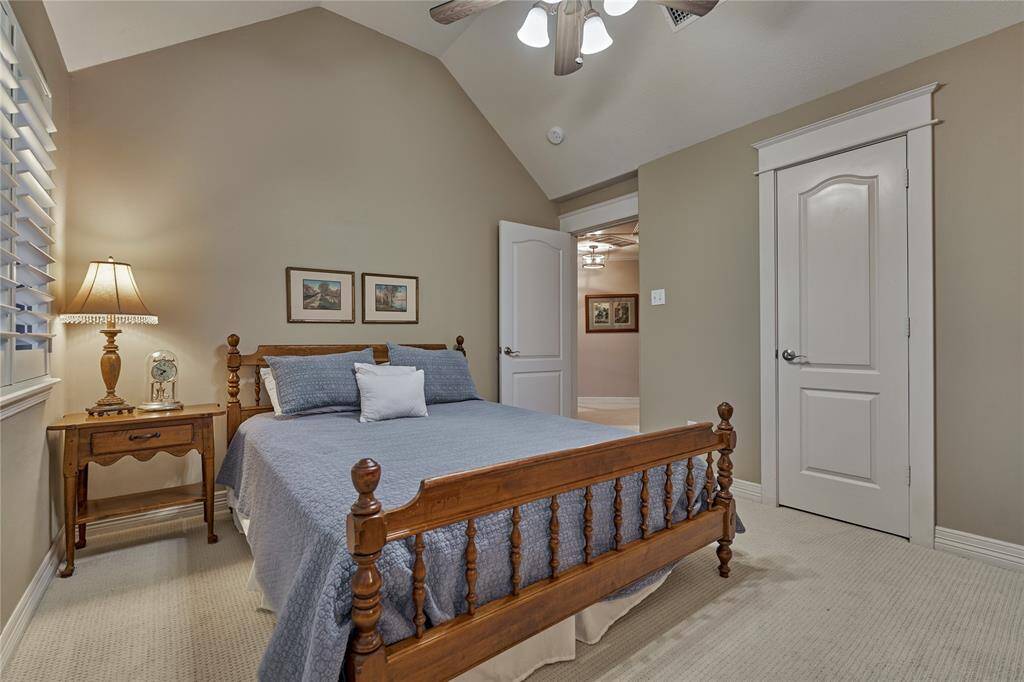 Bedroom #2 features elevated ceilings, plush carpeting, plantation shutters and lovely golf views.