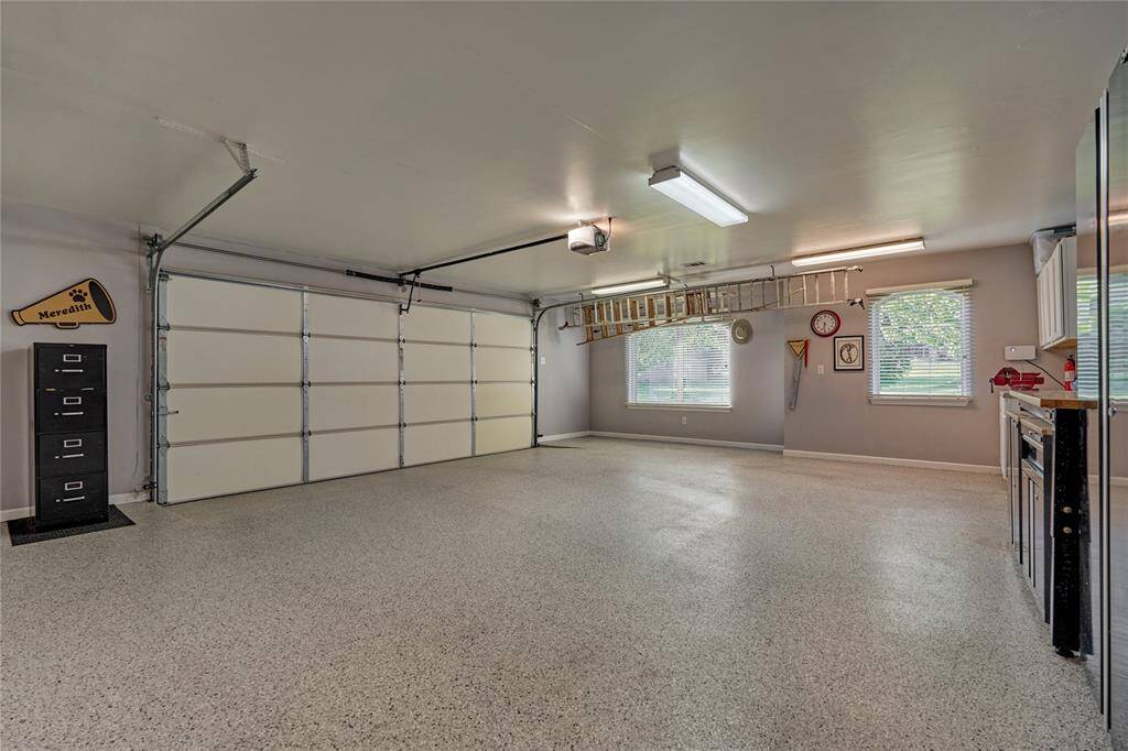 Oversized insulated garage with AC and Heat! Epoxy flooring was installed in 2020.
