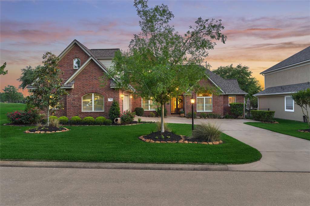 The charming curb appeal is enhanced by lush landscaping and mature foliage.