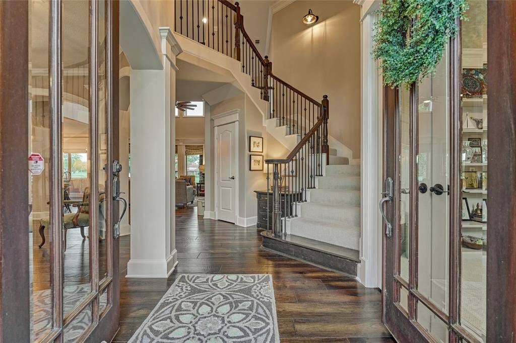 Discover elegance as you enter, with a stunning cascading staircase welcoming you inside.
