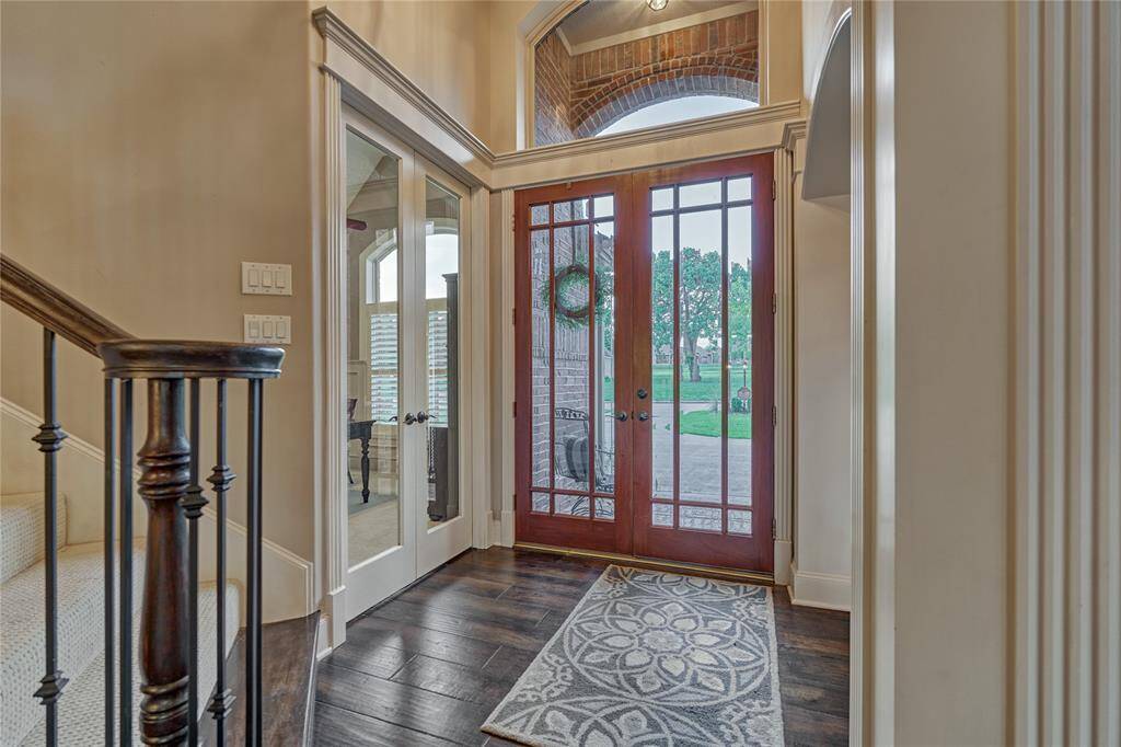 Striking trim work and updated engineered hardwood flooring in the foyer and throughout the main living areas.