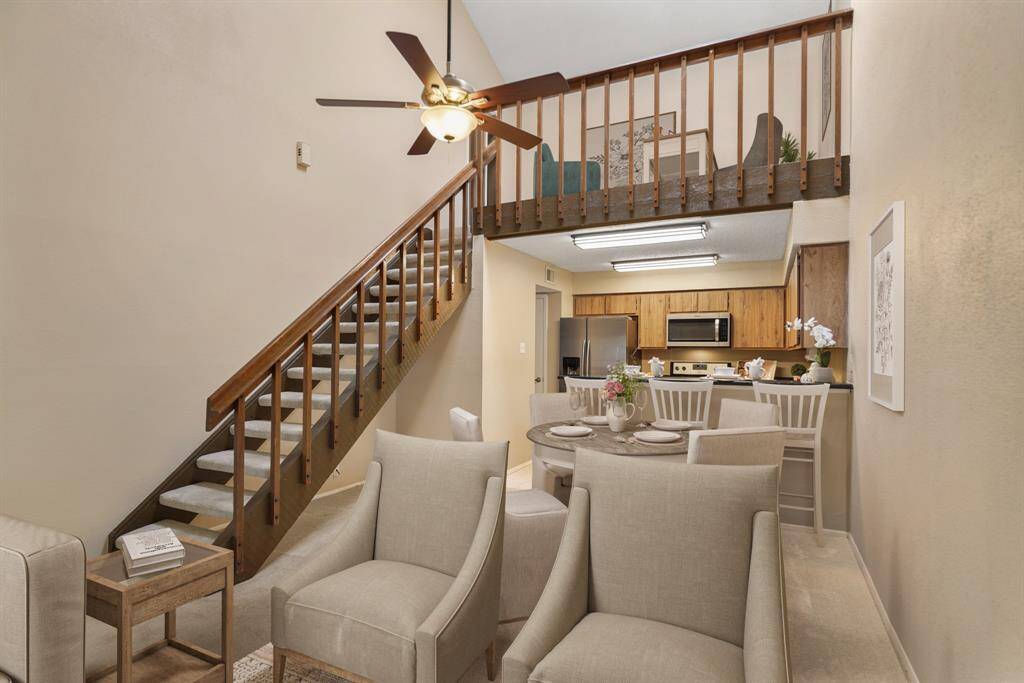 The dining room sits just between the living room & kitchen. This photo has been virtually staged.
