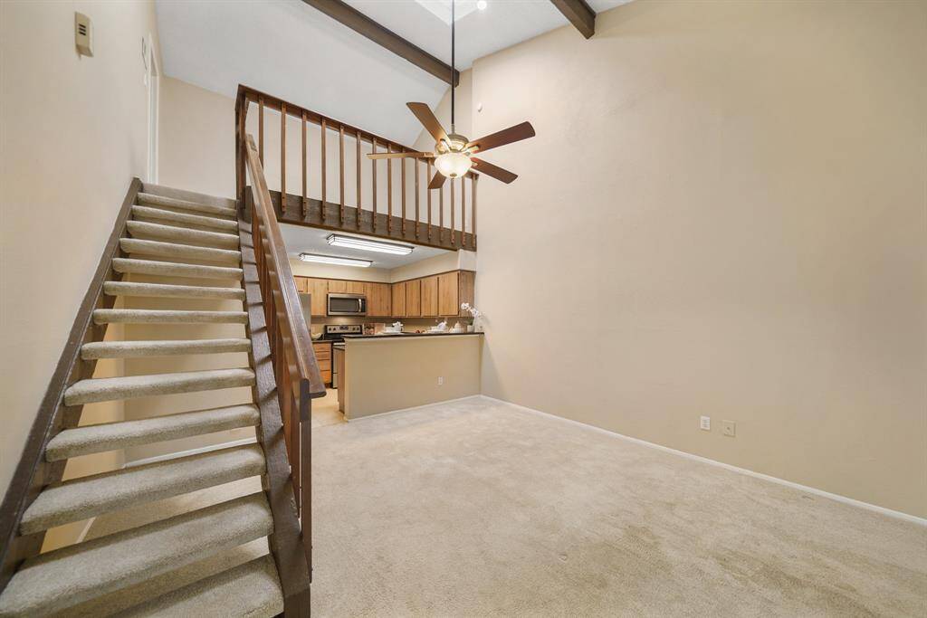 The staircase leads to a second floor loft.