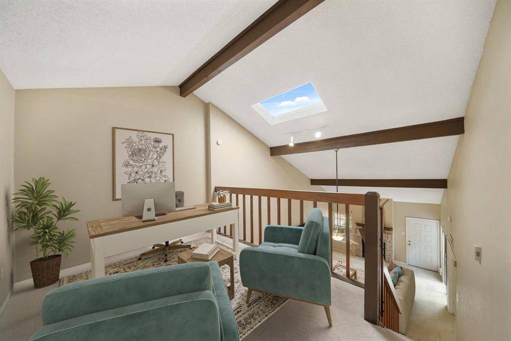 This flexible space is perfect for a study, home office, second floor living area, game room etc. This photo has been virtually staged.