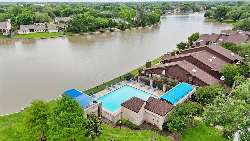 Enjoy the view of the lake and fountains while swimming and relaxing in the nearby community pool with pool side cabana!