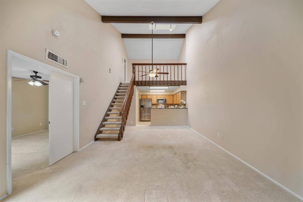 The double door entry on the left opens to the first floor owner's suite with access to a full bath.