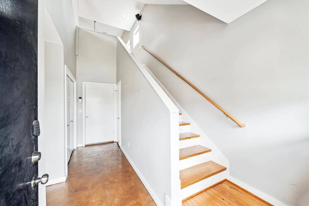 Entry with wood stairs
