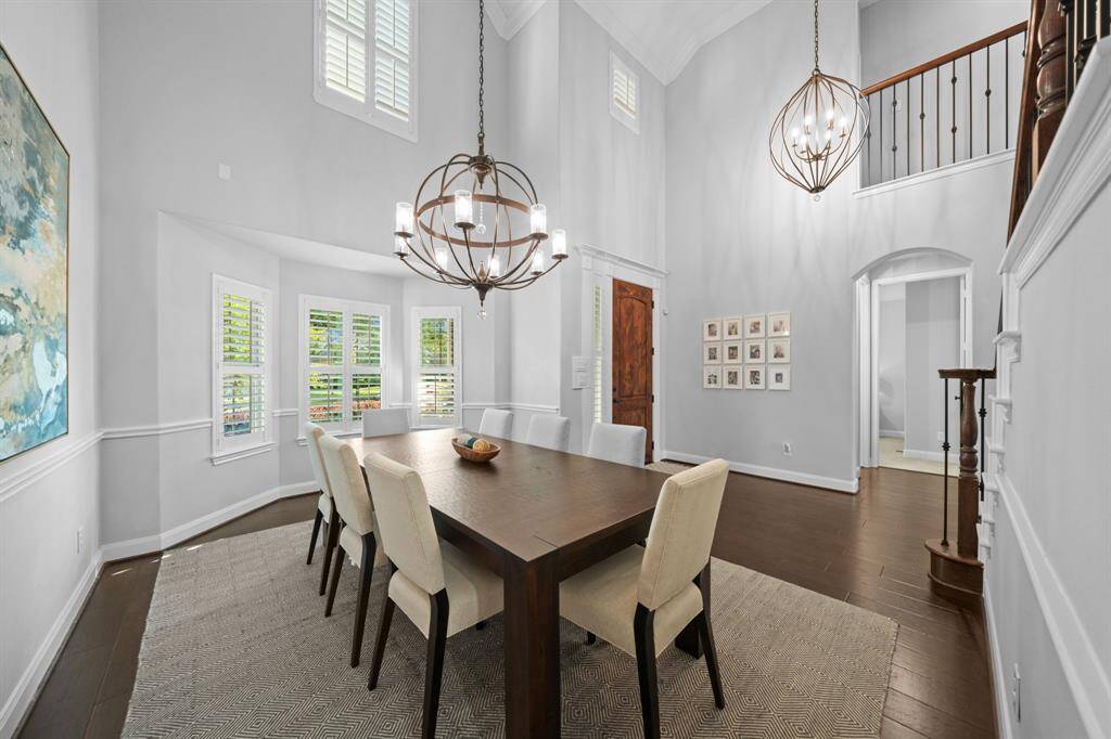 The soaring walls, painted in a soft light gray, enhance the home's sense of spaciousness and openness.