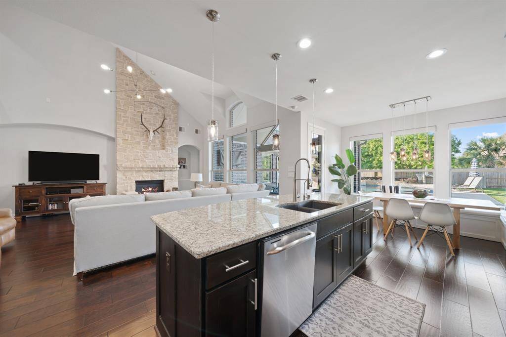 The kitchen flows seamlessly into the family room, creating an open-concept space that encourages easy communication and effortless transitions between areas.