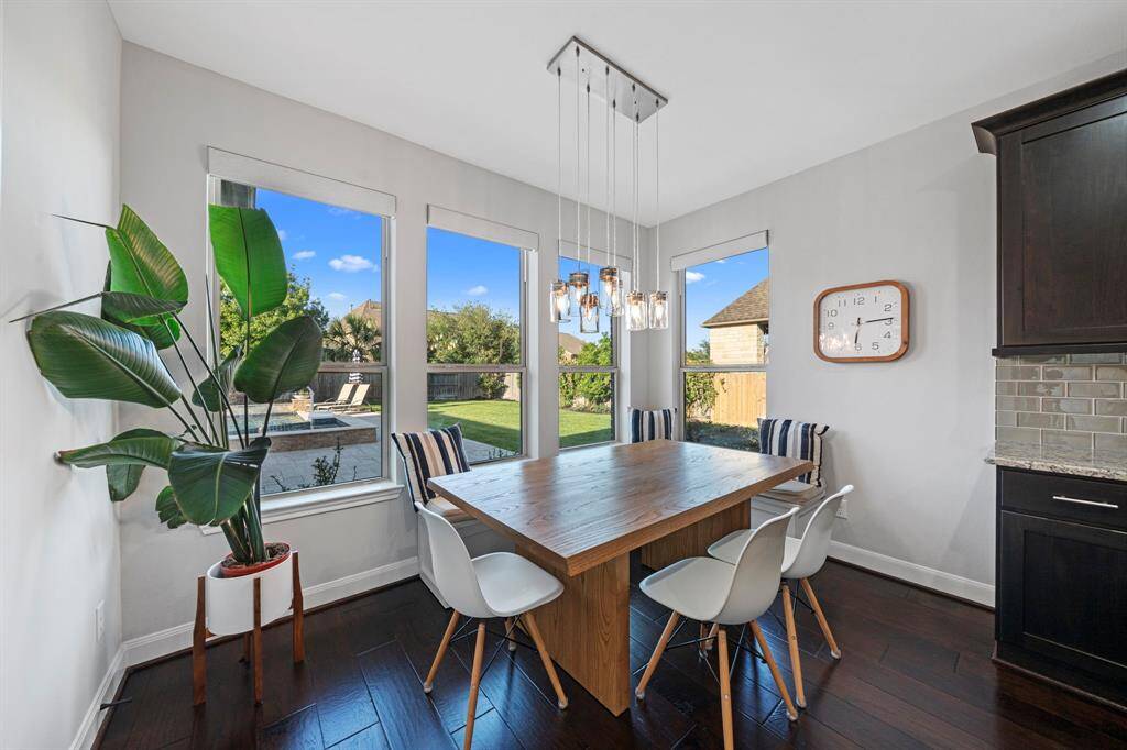 The breakfast nook overlooks the patio pool. Comfort, relaxation and luxury all in one picture.