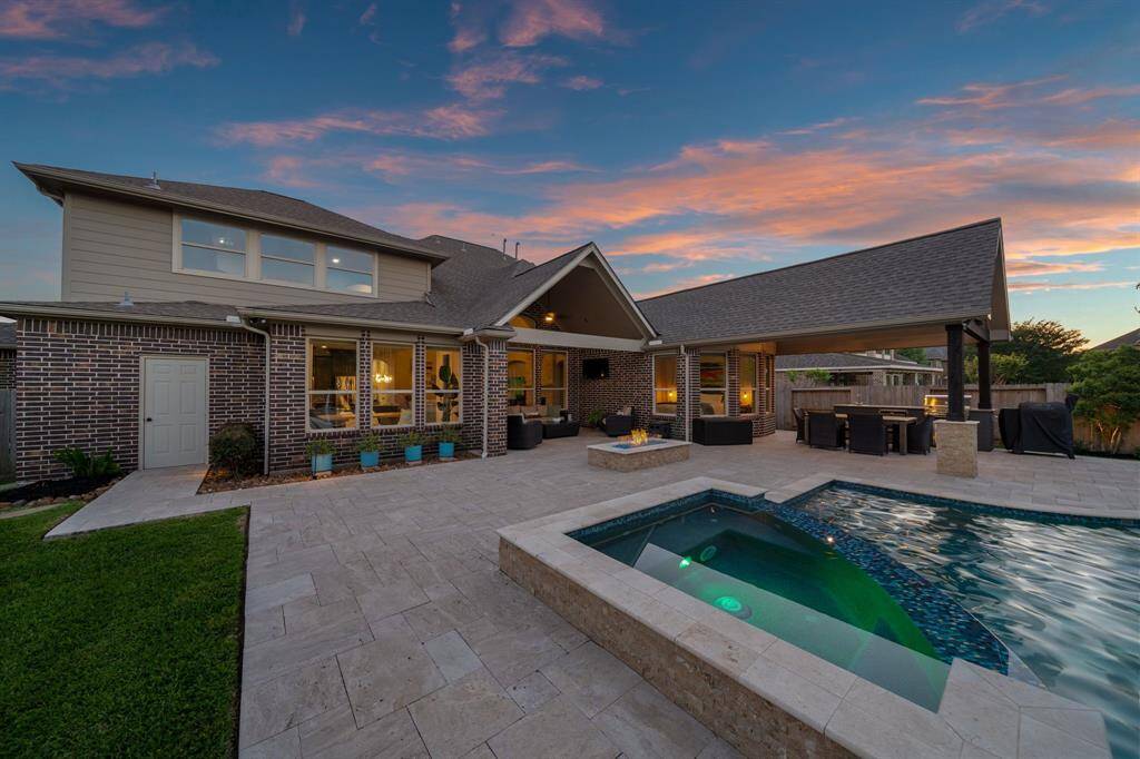 At twilight, the pool transforms into a serene oasis.