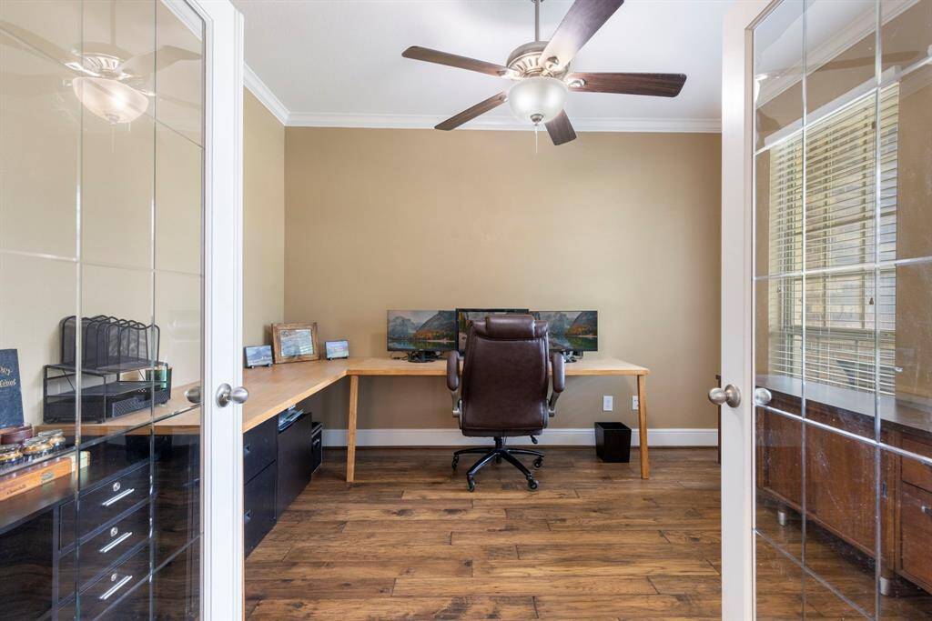 Double glass door open into the homes study with plenty of natural light.