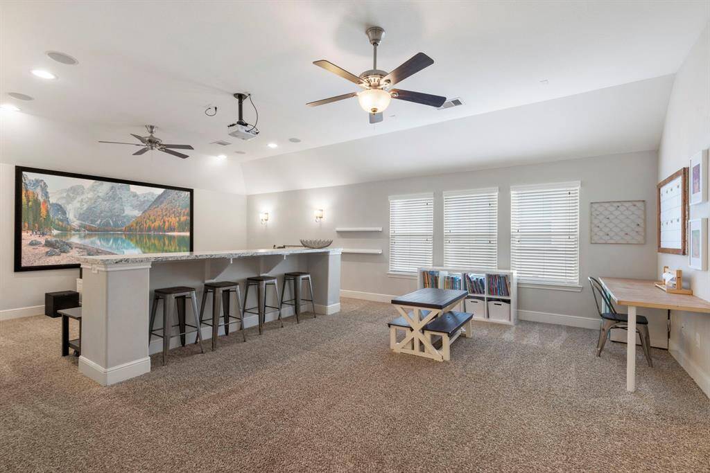An oversized flex room is ideal for play, game or media entertainment and features bar height seating area for snack time.