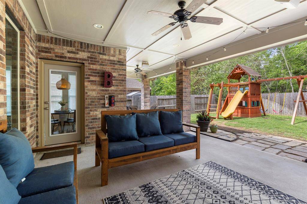 Exterior highlights: stone and brick exterior with wood finished outdoor ceilings.