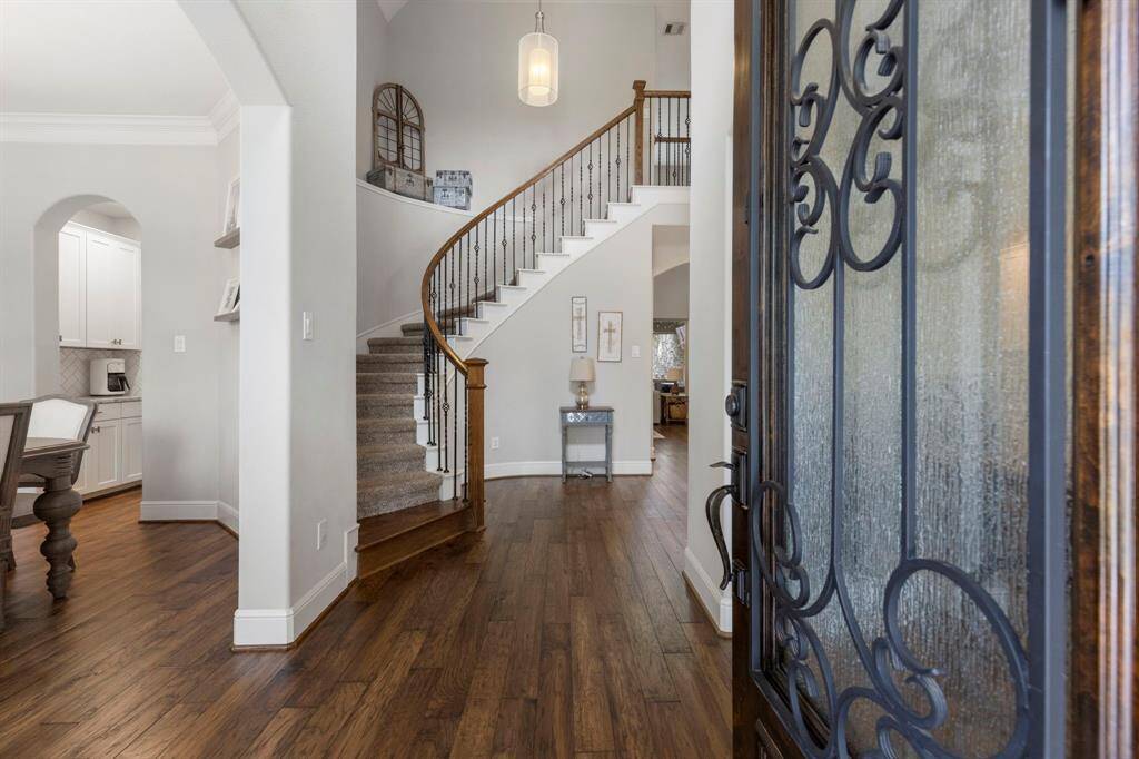 Inside features a light, bright neutral palette that compliments high ceilings and warm engineered wood flooring.