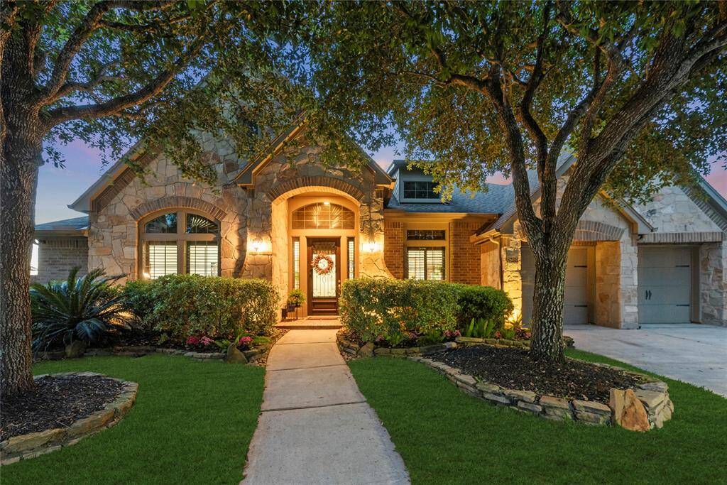 Welcome home to 26919 Wolfs Hill Lane, nestled in the prestigious Pine Mill Ranch community!