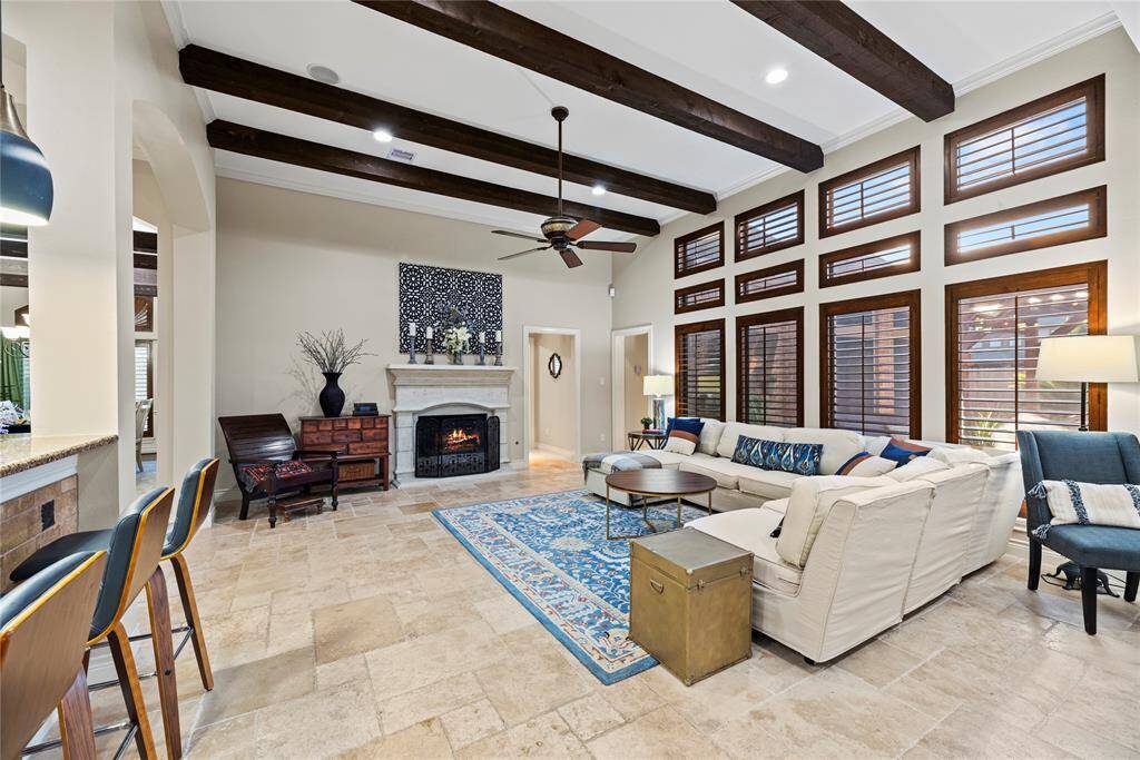 The inviting fireplace becomes a focal point that anchors the room and invites people to gather and linger, making it a cherished feature of the living area.