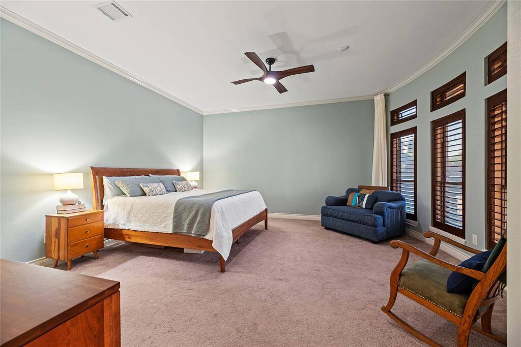 How perfect is this primary suite? Spacious and filled with natural light, this serene retreat offers the ultimate escape, promising comfort, tranquility, and pure relaxation.