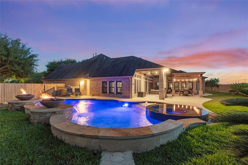 The illuminated pool at night is simply breathtaking—glowing with soft, ambient lighting that creates a serene, resort-like atmosphere. Whether you're enjoying a quiet evening swim or entertaining guests under the stars, this stunning backdrop turns every night into a private retreat.