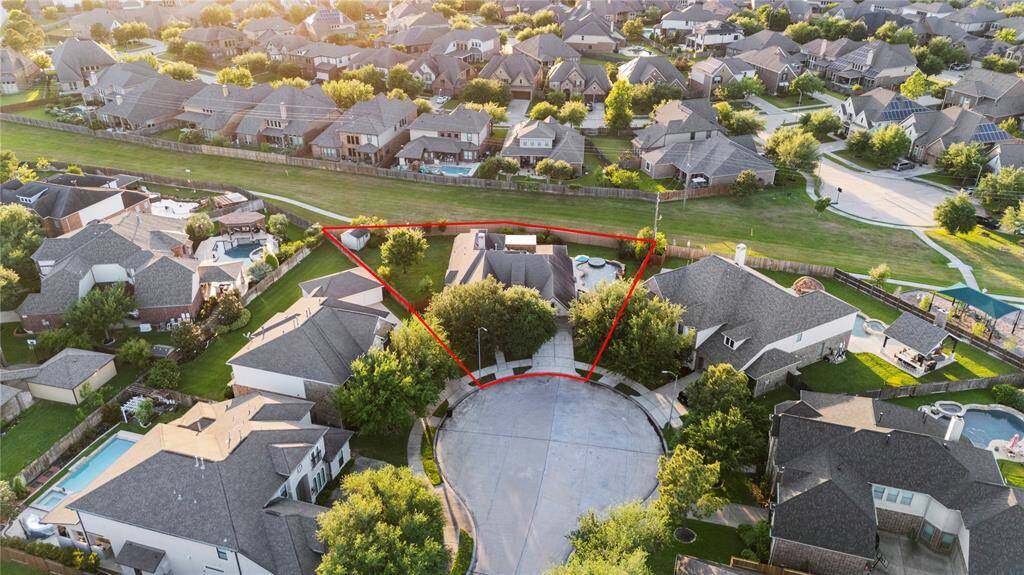 This impressive aerial view showcases the prime location of this cul-de-sac lot, perfectly positioned with no back neighbors.