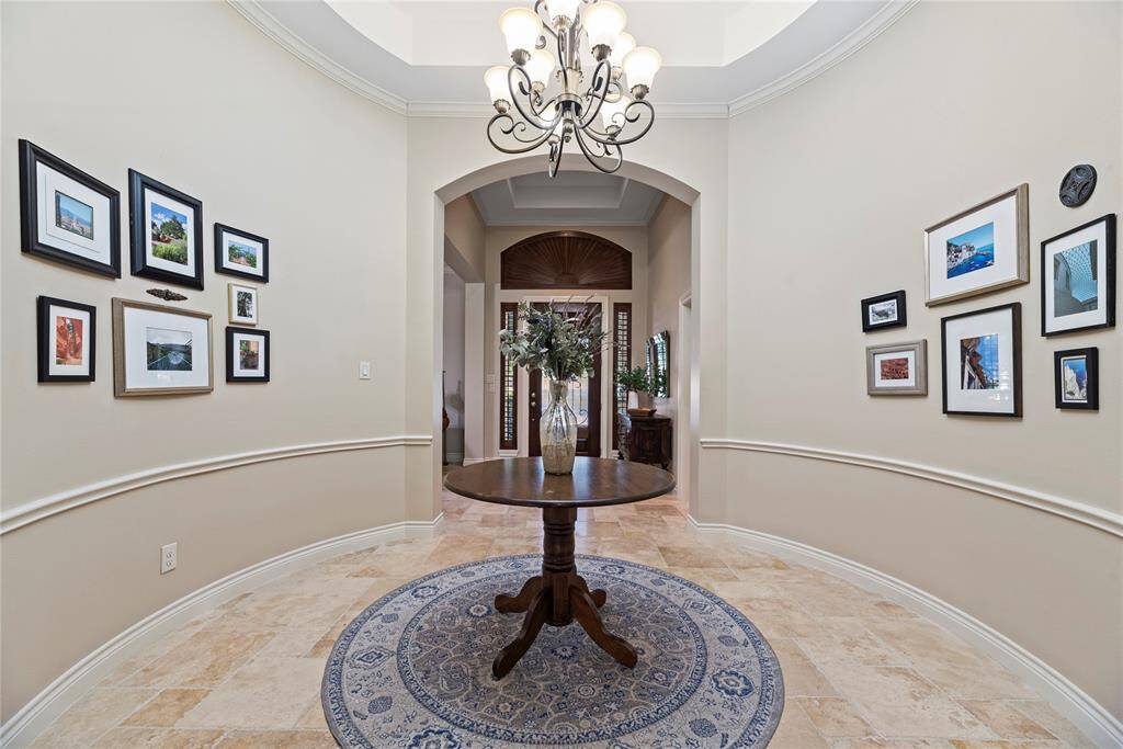 Step into a stunning rotunda foyer that makes a lasting first impression with its soaring ceiling, elegant architectural detailing, and timeless design.