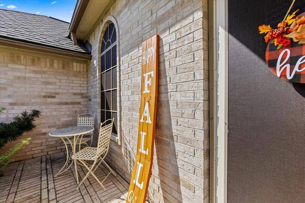 Welcome to your serene porch retreat, a cozy nook perfect for morning coffees and neighborly chats amidst the vibrant community backdrop.