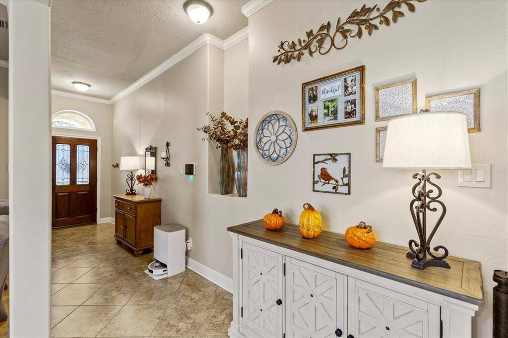 Welcome to elegance and comfort in this home featuring a grand foyer that opens to a sophisticated formal dining and spacious living room. Bathed in natural light and designed for both grand entertaining and intimate everyday moments, this home masterfully combines luxury with practicality.