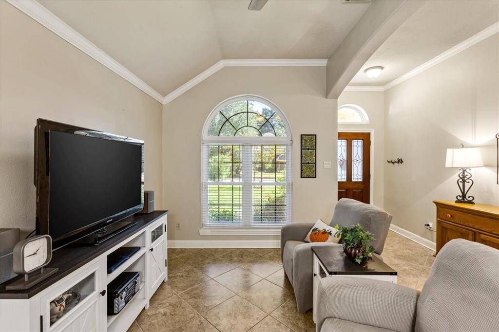 Another view of the formal living room highlights its potential as an excellent home office. With its spacious layout, abundant natural light, and quiet atmosphere, it offers the perfect environment for productivity and focus, while still maintaining the refined charm of a formal living space.