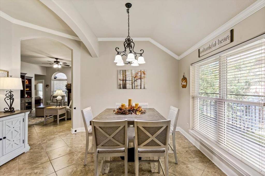 Another view of the formal dining room reveals its generous space, offering plenty of room for a china hutch and a large dining table. Perfect for hosting dinners and special occasions, this elegant area provides both style and functionality for memorable gatherings.