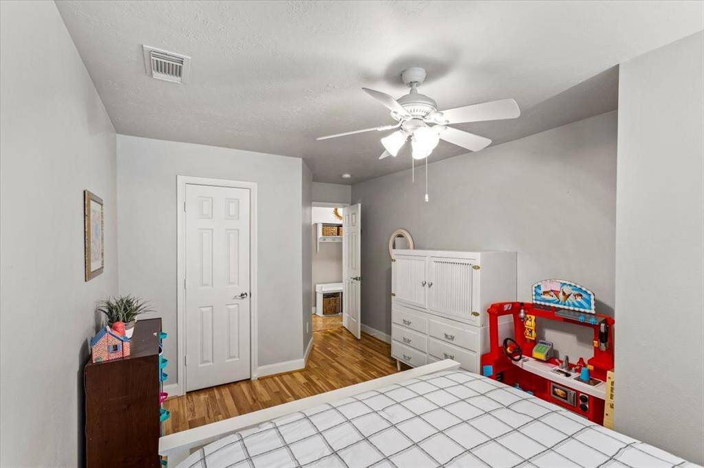 The secondary bedrooms feature beautiful laminate flooring and stylish designer paint, creating inviting and personalized spaces. These thoughtfully designed rooms offer a perfect blend of aesthetics and functionality, making them ideal for family, guests, or a home office.
