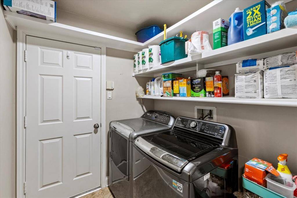 The utility room, conveniently located just off the garage, offers ample space for storage and organization. This functional area is perfect for managing household items, keeping your home tidy, and providing easy access to everything you need.