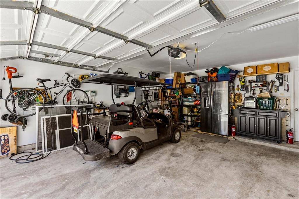 The garage is equipped with both 220-volt and 110-volt outlets, making it ideal for charging your electric car or golf cart. This thoughtful feature enhances convenience and functionality, catering to modern lifestyles with ease.