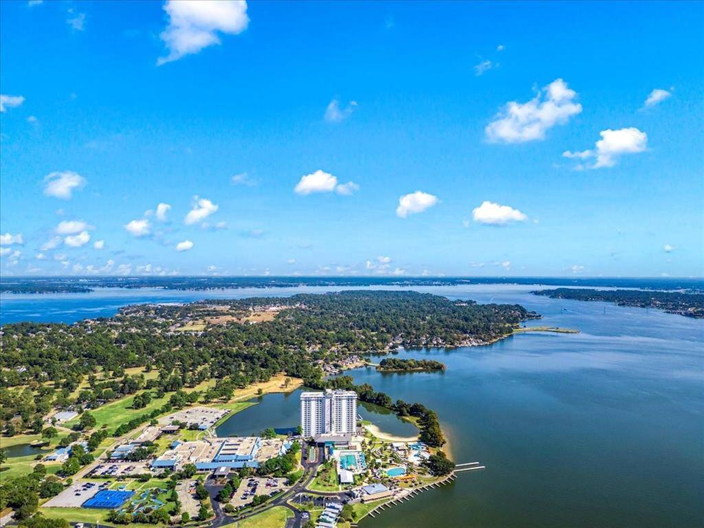 The neighborhood offers a fantastic boat dock, and the lake is just a short walk down the hill from this home, providing easy access to water activities and leisure.