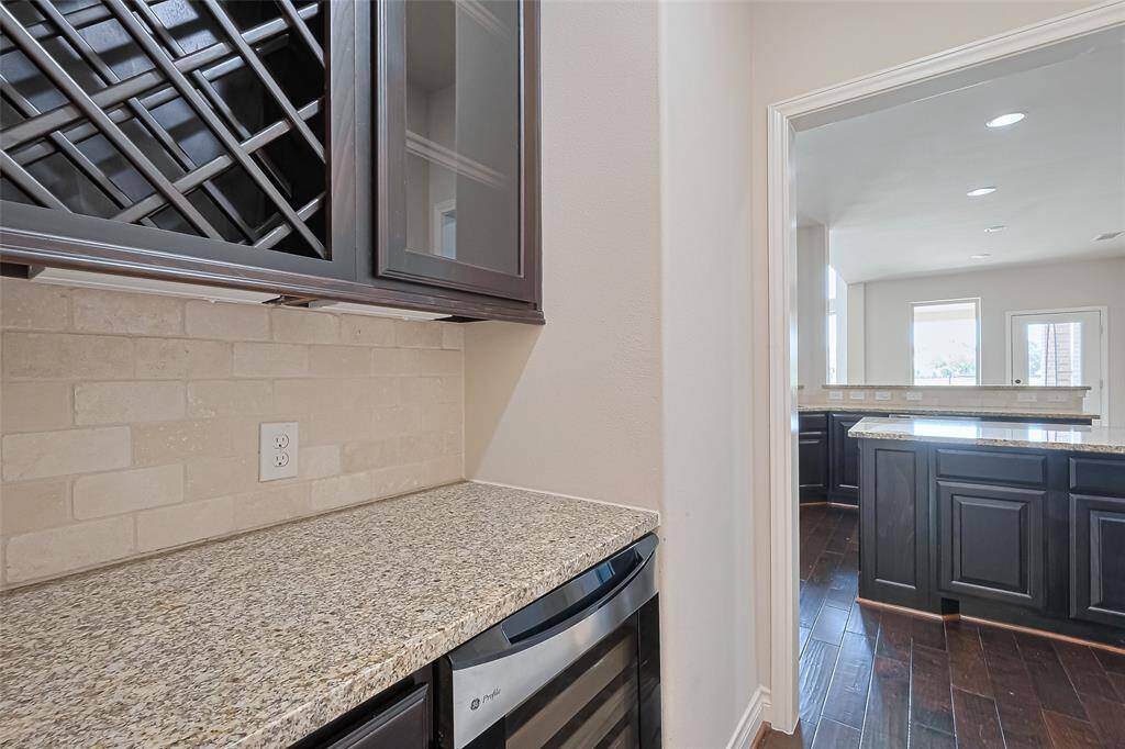 The butler's pantry is perfect for a coffee and wine bar with easy access to the kitchen or dining area.