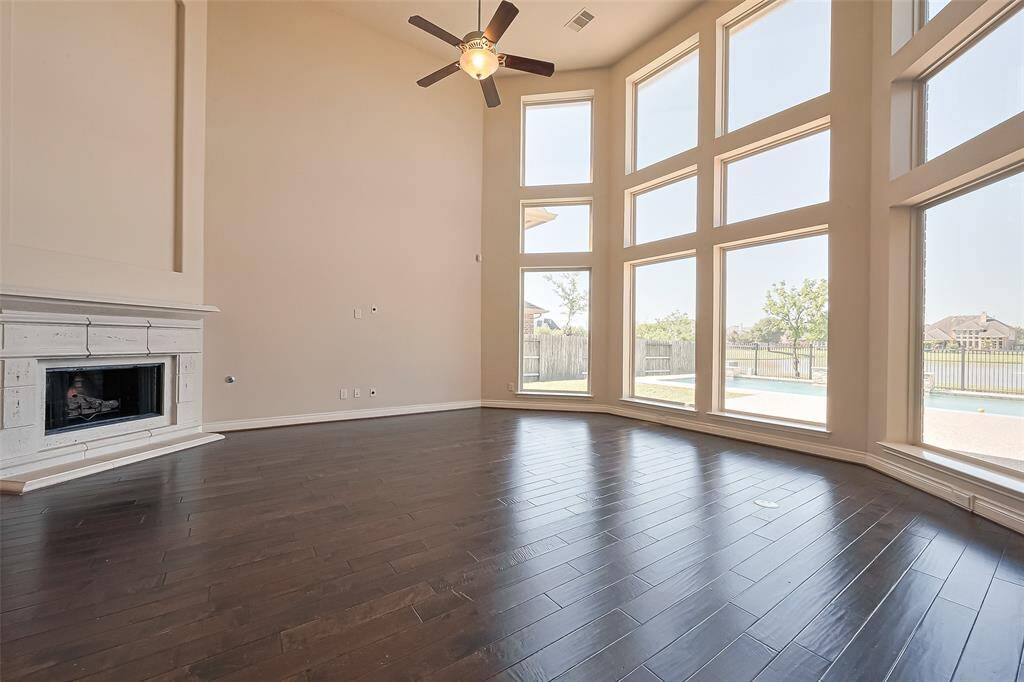 As soon as you enter, the wall of windows across the family room offers a breathtaking view of the pool and lake!