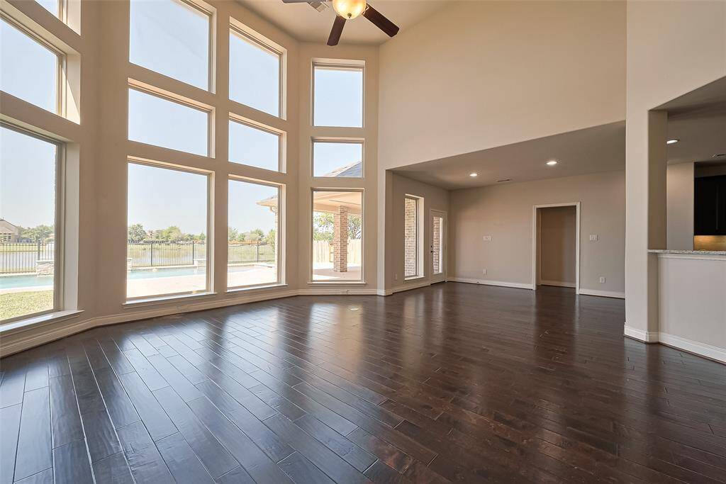 There is direct access to the covered patio through the breakfast area and the second downstairs bedroom and bathroom are located right off of the kitchen.  Great for pool guests!
