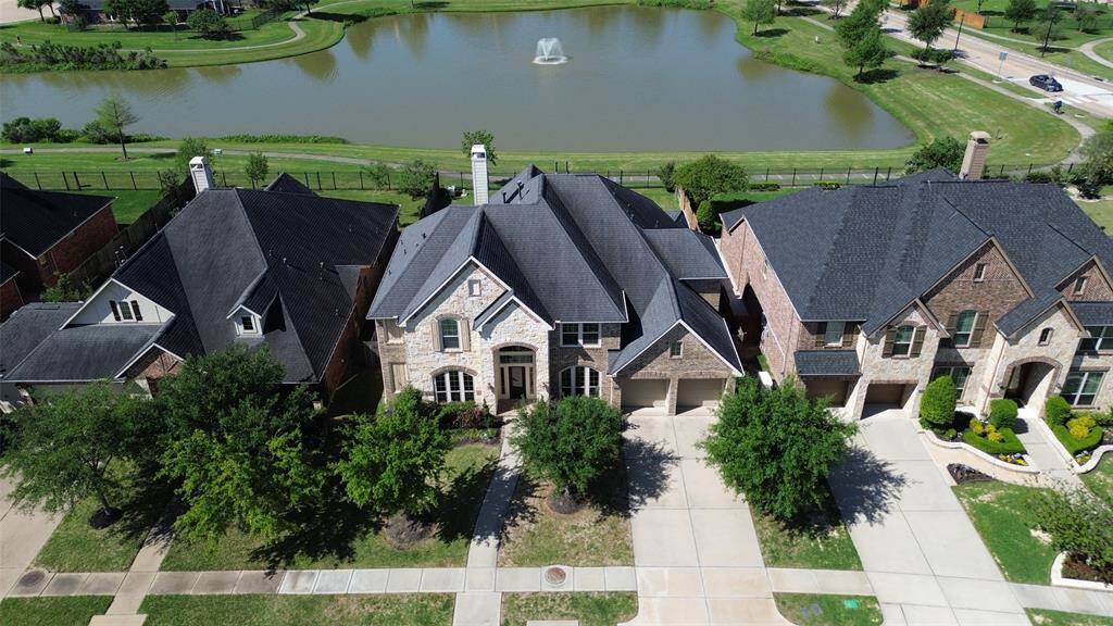 Stunning 5 bedrm/4.5 bath WATERVIEW home in the master planned community of Firethorne zoned to Katy ISD.