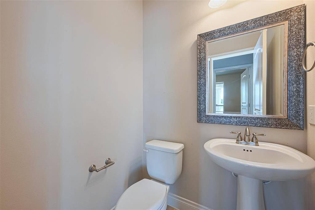 Half bathroom conveniently located downstairs.