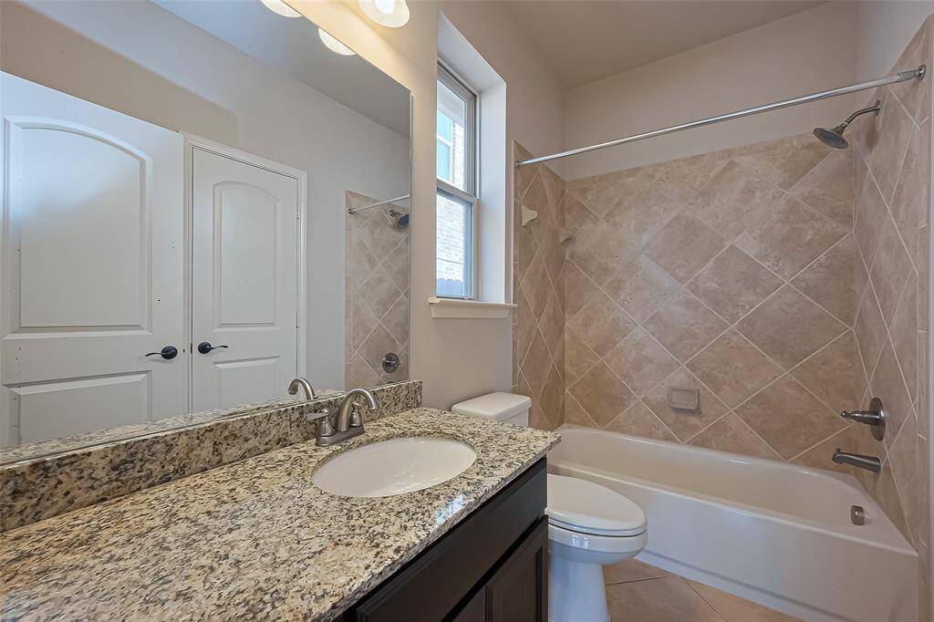 Full bathroom in the downstairs secondary bedroom.