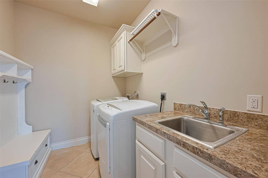 Large laundry room with sink.  Washer and dryer included in the rental.