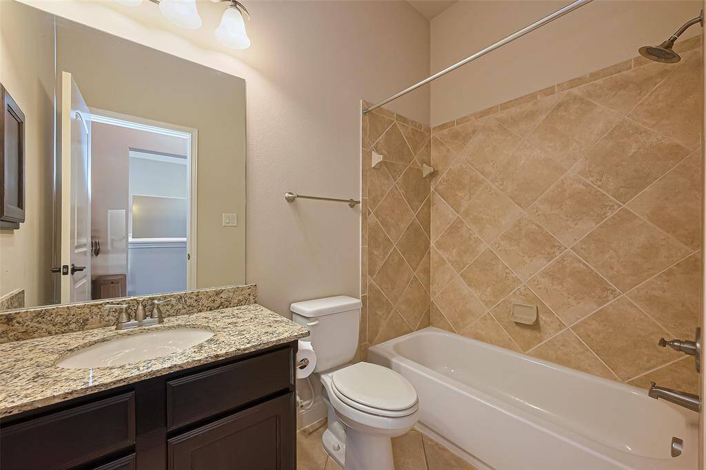 Upstairs Bathroom with tub/shower combo is shared with gameroom area and Secondary Bedroom 1