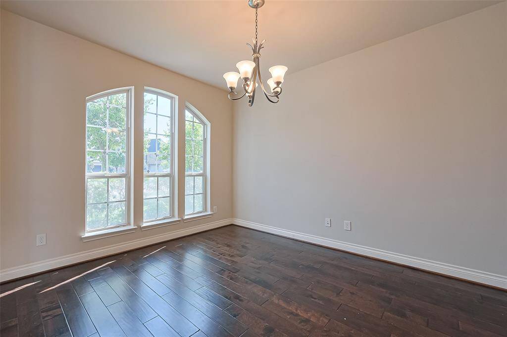 Formal living area space is light and bright and would be great to set up a home office or even a pool table!
