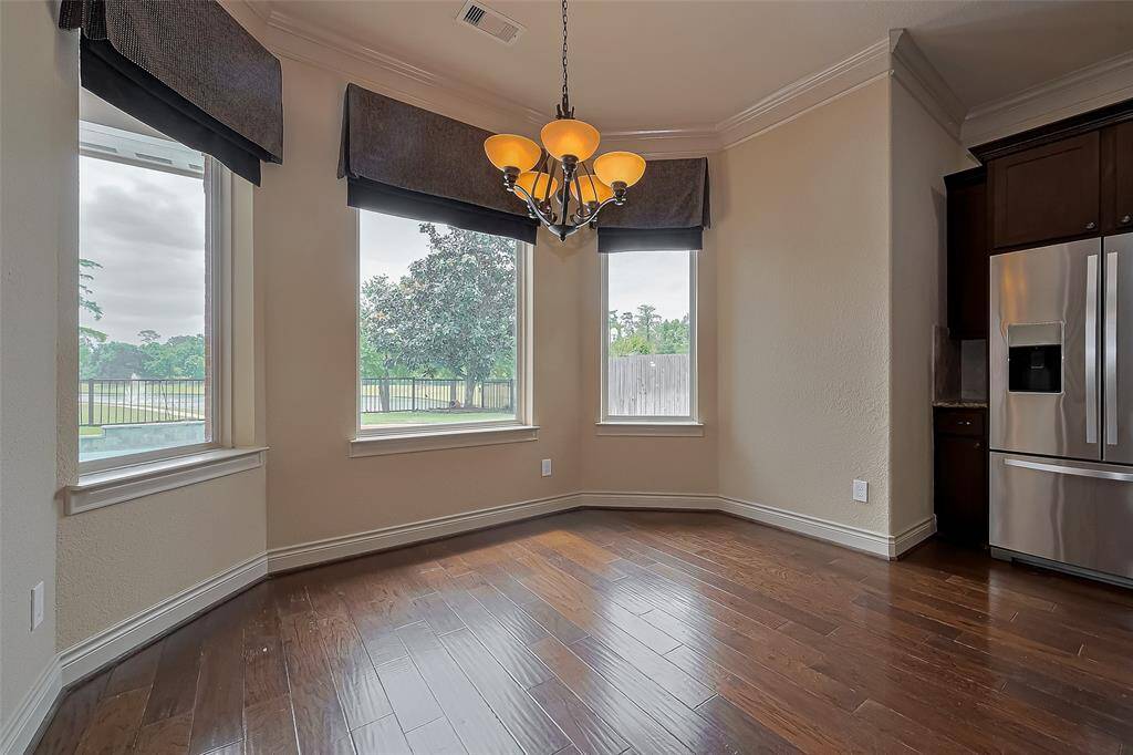 Sizable Formal Dining Room flows to Den.