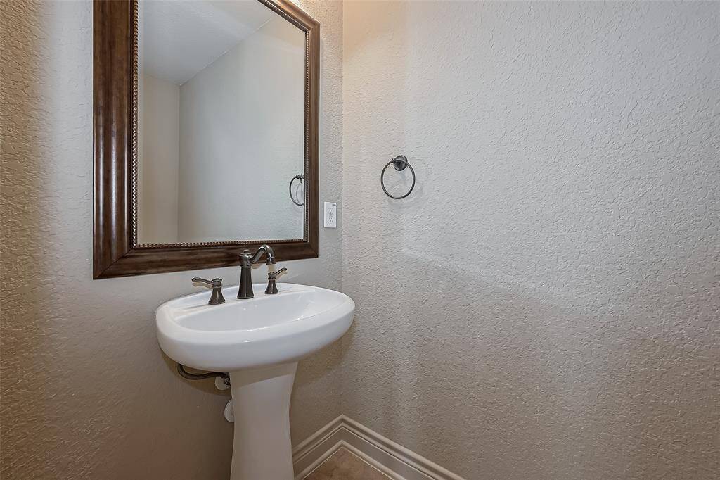 Oversized Separate Shower has built in seat.