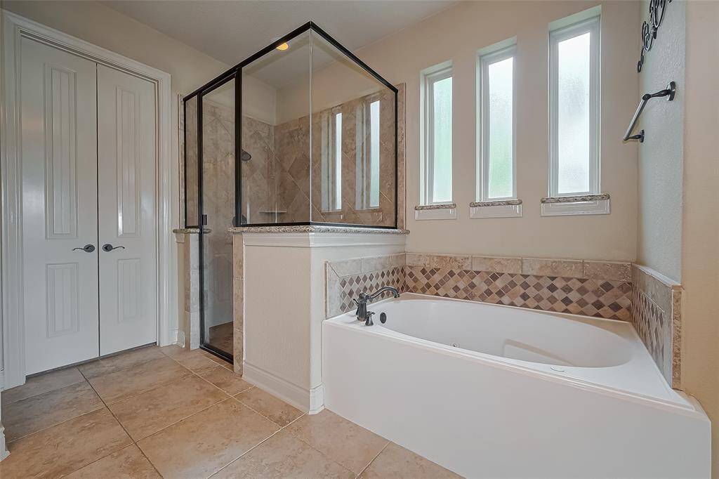 Plenty of space in Primary closet & door to Utility Room.