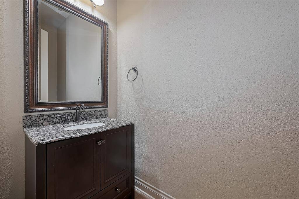 Secondary Bedroom with  ceiling fan & walk in Closet.