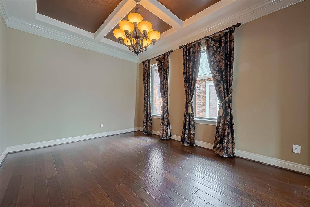 Huge Formal Dining Room features wood floors and inset ceiling making this the perfect place for your Family Holiday Meals.