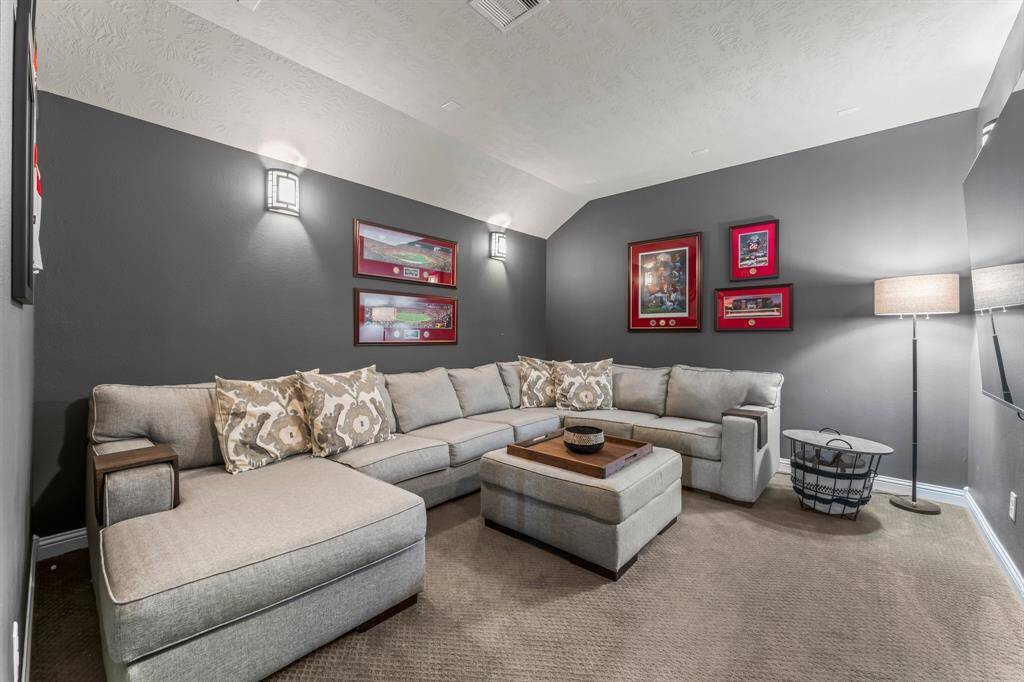 The large media room features soft lighting and is the perfect spot to watch your favorite movies!