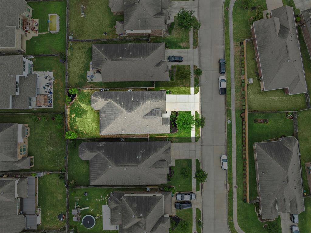 Notice the size of the backyard and the driveway.